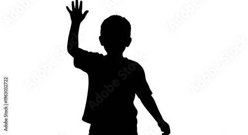 Silhouette of a young boy waving hello.