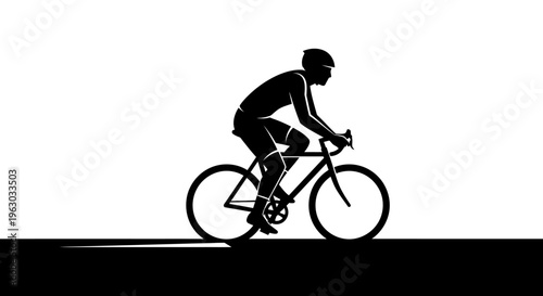 Silhouette of a cyclist in motion on a road.