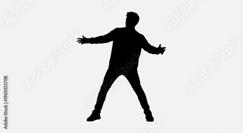 Silhouette of a Man Dancing with Arms Wide Open.