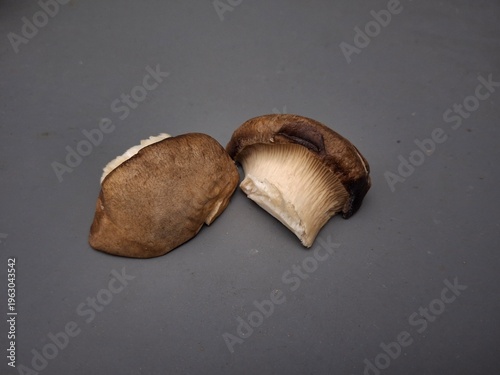King Oyster Mushroom (Pleurotus eryngii). This mushroom is characterized by a very thick, dense, white stem and a small, brown cap. Texture and Flavor: The stem has a chewy texture