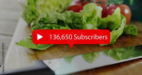 Subscriber badge rising from center, overlaying board, knife, lettuce, counting up for social media
