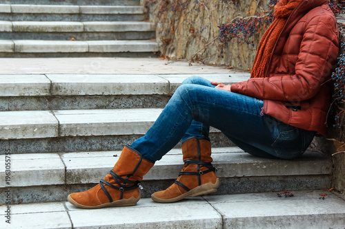 Woman sitting on the stairs