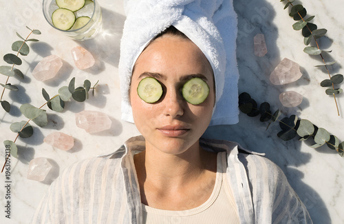 Cucumber Spa Retreat: A serene individual with a towel and cucumber slices for self-care.