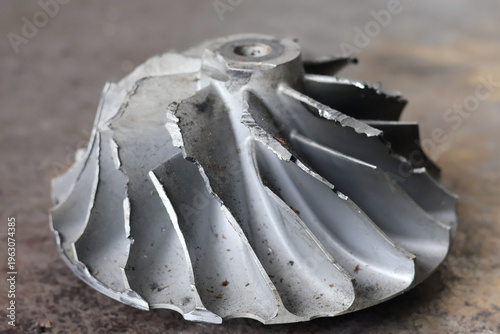 Принти на полотні A close-up view shows a damaged, fractured silver aluminum compressor wheel for