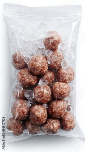 Frozen meatballs arranged in clear plastic bag