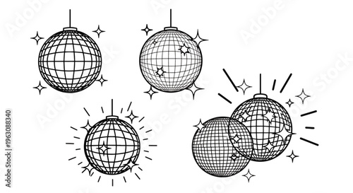 Disco balls hanging with sparkling lines around them in black and white