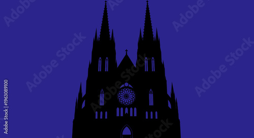 Silhouette of a gothic cathedral with two spires and a clock in the center.