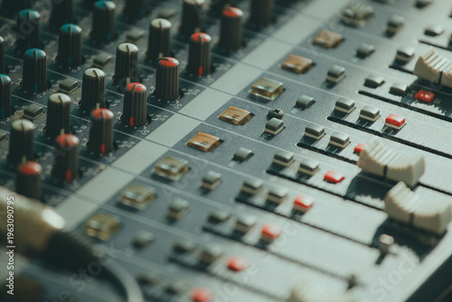  Mixing console. Audio mixer. Green tint of light