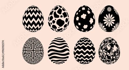 Collection of eight black and white Easter eggs with diverse patterns.