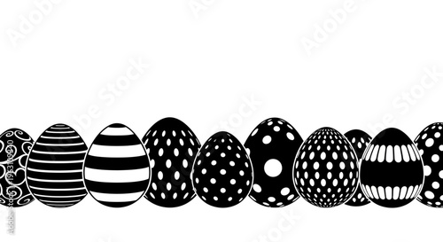 Row of black and white patterned Easter eggs in a seamless border design.