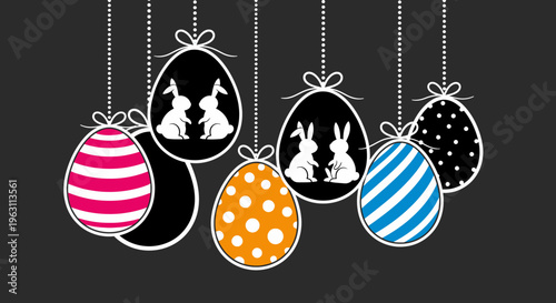 Colorful Easter Eggs with Bunny Silhouettes Hanging on Strings.
