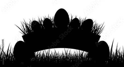 Silhouette of Easter eggs in a basket nestled in grass.