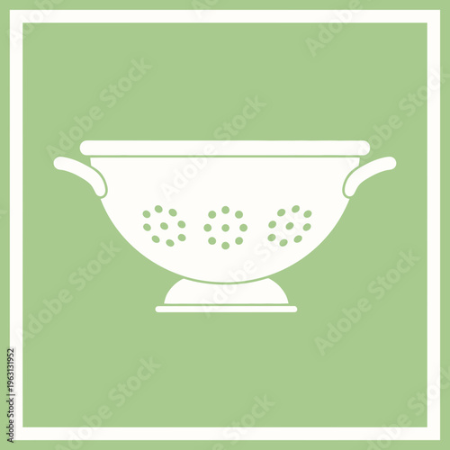 White kitchen colander with handles.