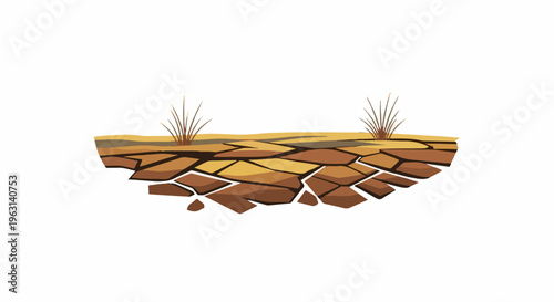 Cracked earth ground with two small tufts of dry grass