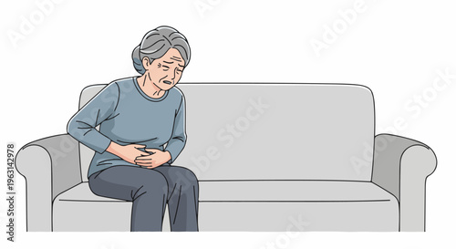 Elderly woman on couch holding stomach in pain