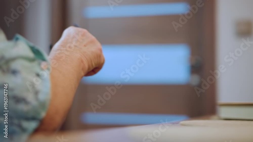 Grandma adjusts glasses. White grandmother meticulously arranges her glasses each morning. An elderly white woman carefully lifts and positions her spectacles during her morning routine