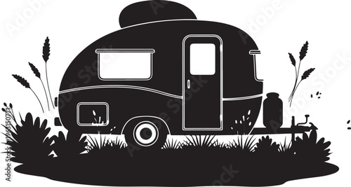 Black silhouette of vintage camper trailer with grass and plants