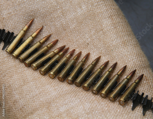 Wallpaper Mural An Ammunition Belt of Large Bullets Resting on Sacking. Torontodigital.ca