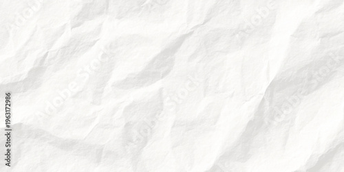 A vintage blank sheet of white crumpled paper features a rough wrinkled texture and creased pattern, creating an aged grunge background surface perfect for an empty parchment design