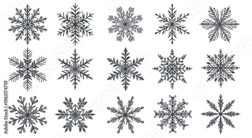 Collection of intricate snowflakes on a plain surface for winter designs