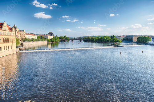 Vltava River flowing through Prague on sunny summer day