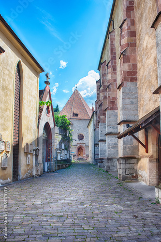 Cobblestone street leading to St. Barbara's Chapel, Merano, Italy