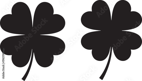 Two black four-leaf clovers, lucky shamrock symbols, St. Patrick's Day graphic elements, good fortune vector icons for design projects