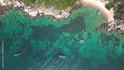 Aerial View of Ko Tao Bay with Longtail Boats and Rocky Beach Thailand