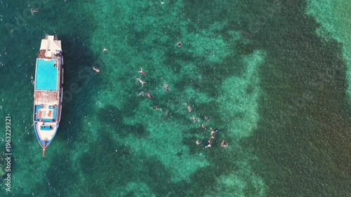 Aerial View of Longtail Boat and Snorkelers in Ko Tao Bay Thailand