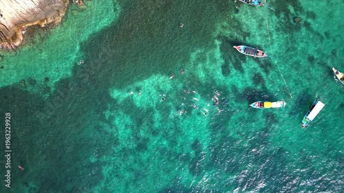 Top Down Aerial View of Longtail Boats and Snorkelers Ko Tao Thailand