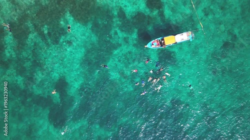 Aerial View of Longtail Boat Surrounded by Snorkelers Ko Tao Thailand