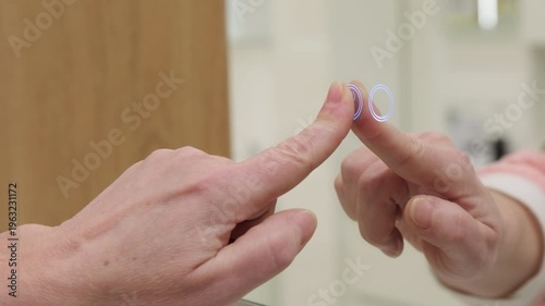 Woman with finger pressing touch button of backlight on mirror 