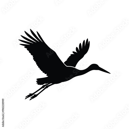 Black silhouette of a flying crane bird