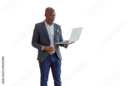 Bilde på lerret Black businessman holding laptop, focused on digital information, working with t