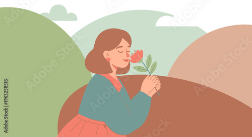 Woman Smelling a Flower in Nature.