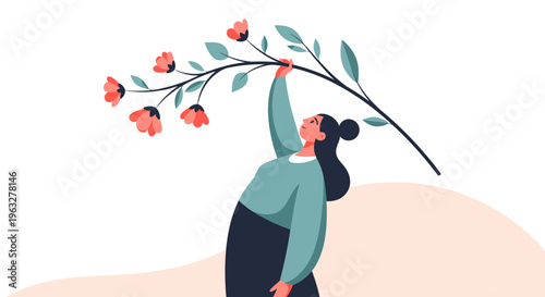 Woman holding a branch with flowers.