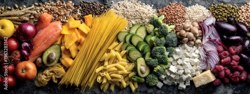 A vibrant and abundant display of fresh fruits, vegetables, pasta, and grains arranged artfully.