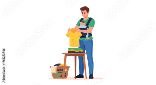 A father, wearing a green t-shirt and blue jeans, with a baby in a blue carrier, stands folding a yellow t-shirt from a stack of laundry on a wooden stool, with a basket nearby.