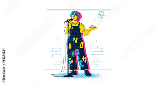 A nonbinary person with curly hair in letter-adorned overalls performs poetry with a microphone on a stage under a spotlight.