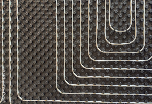 Radiant floor heating layout with pipes installed on thermal insulation