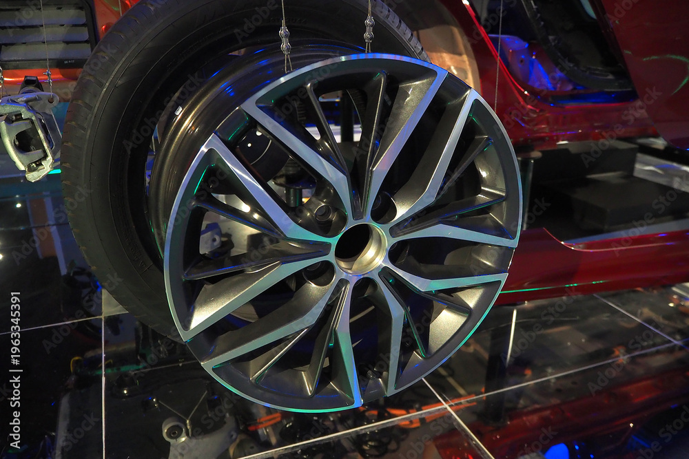 Fototapeta premium Modern alloy car wheel and tire close up on vehicle display