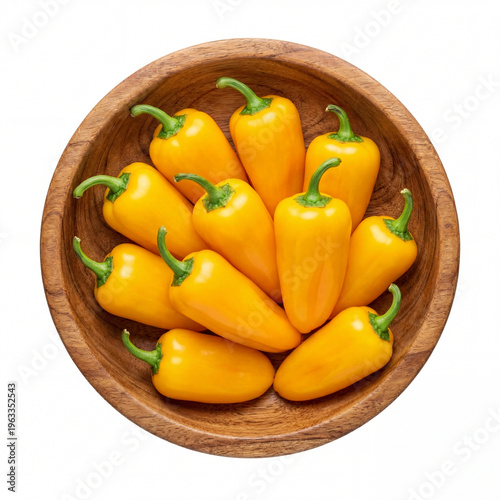 A generous cluster of fresh vibrant yellow mini bell peppers with green stems arranged in a rustic wooden bowl, isolated on white background