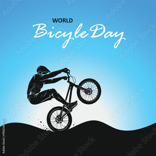 Silhouette of stunt biker performing wheelie jump on hill for World Bicycle Day with blue gradient background