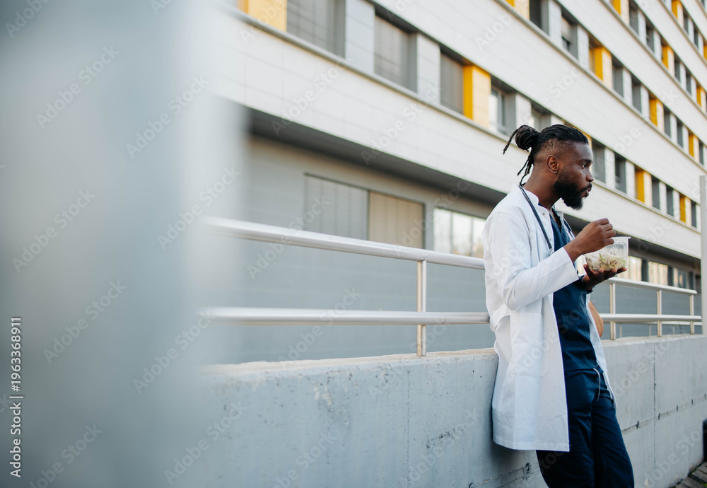 Fototapeta premium Male healthcare worker on a lunch break