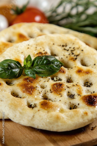 A close-up shot of two sliced flatbreads on a wooden cutting board, perfect for food and kitchen-related compositions