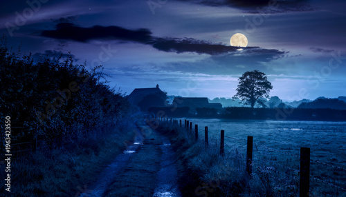 Countryside path leading to farm under full moonlight