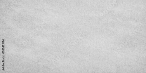 A close-up shot of a textured stone wall with natural cracks and a weathered gray surface perfect for architectural backgrounds