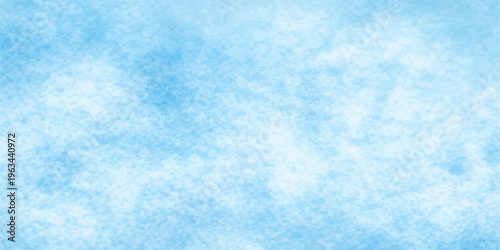 An abstract blue sky background with white clouds and a soft winter snow texture creates a cold nature pattern of ice and light in the summer air