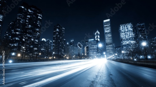 Nighttime Cityscape with Blurred Lights and Tall Buildings