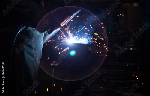 A professional industrial TIG welding machine with torch and digital display, isolated on a white background for manufacturing and engineering.